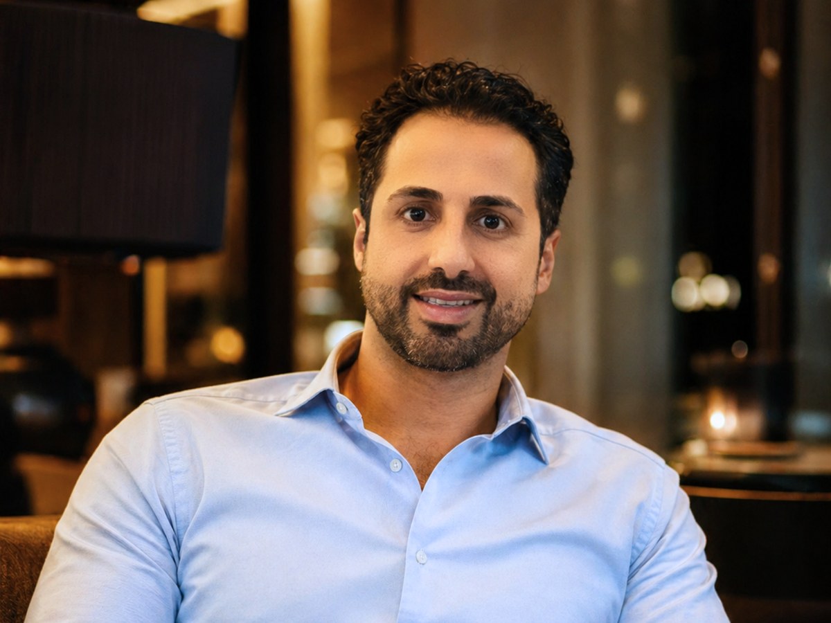 Andreas Tsiartas smiling in a light blue shirt